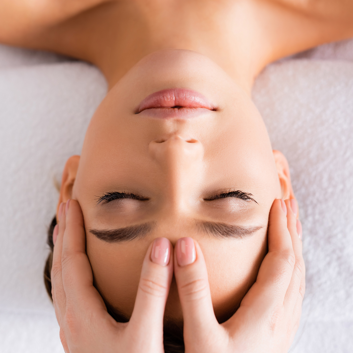 Woman having reiki healing treatment , alternative medicine conc